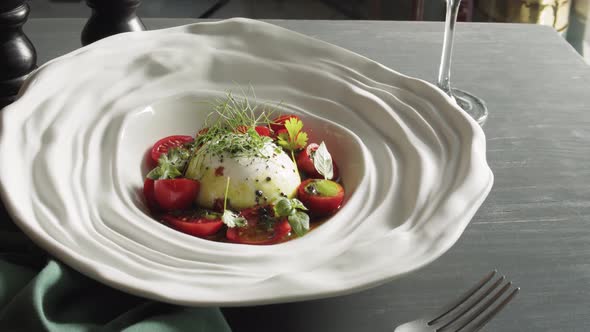 Salad with Burrata Mozzarella Cheese Tomatoes and Leafs of Salad alt