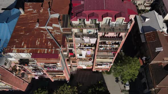 Drone Footage of an Old Rusty Residential Building in Batumi Georgia alt