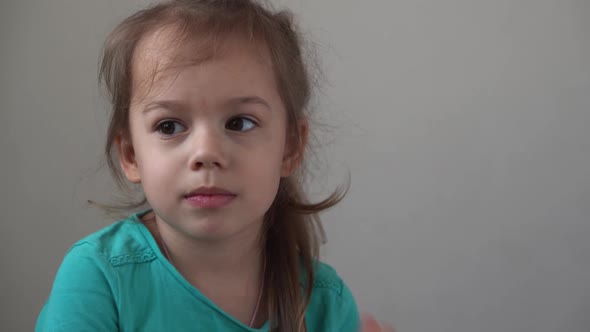 Portrait Funny Little Girl Smiling Child Looking at Camera are Sitting on the Couch at Home Cute Kid alt