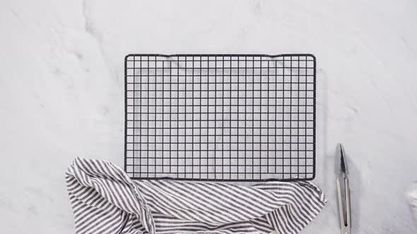 Flat lay. Step by step. Preparing russet potatoes in wedges with olive oil and spices to bake in the alt