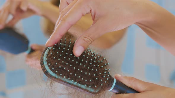 Lots of Fallen Hair on a Comb. Hair Loss Problem, Hormonal Failure, Stress, Diet, Scalp and Hair alt