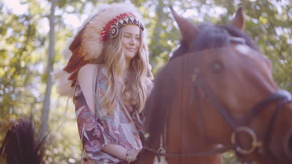 Smiling Woman In Headdress Sitting On Horse Forest alt