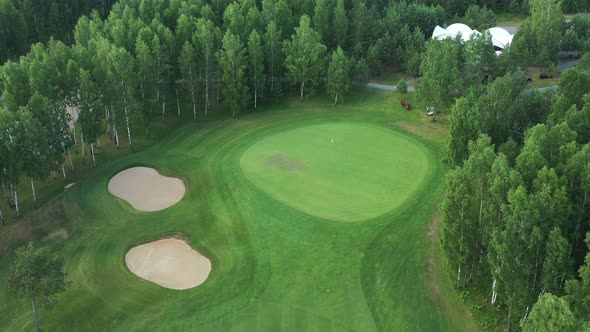 Top View of the Golf Course Located in a Wooded Area