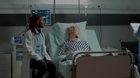 Multi Ethnic Medical Staff Checking on Patient Healthcare alt