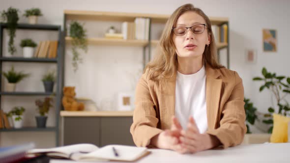 Woman in Glasses Teaching Online Class alt