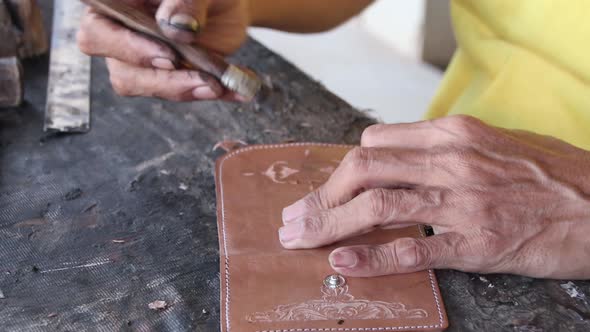 craftsman when carving leather for decoration