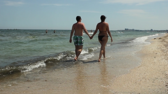 Couple Walking The Beach alt