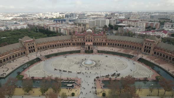 Spain Square or Plaza de Espana and Maria Luisa Park at Seville in Spain. Aerial backward