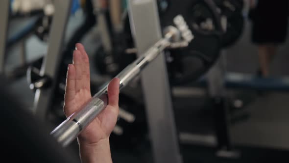 Closeup of a Strong Man's Hands with Talc Getting Ready to Weightlifting at the Garage Gym alt
