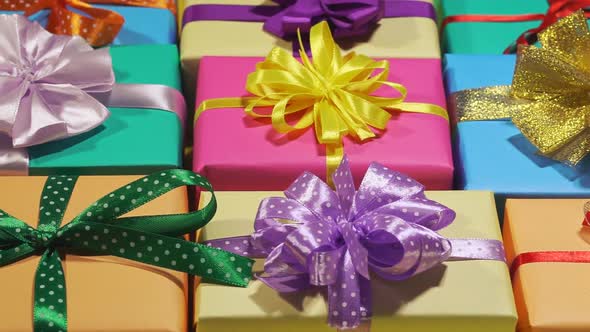 A Lot Of Holiday Gifts In A Beautiful Package With Ribbon Bows alt