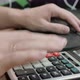 The Man at the Computer Counts the Numbers on the Calculator and Transfers the Amount to the - VideoHive Item for Sale