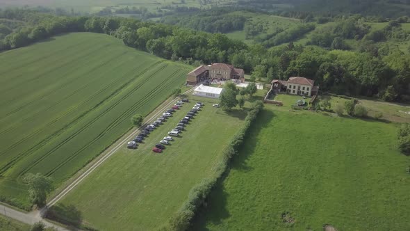 Aerial view of medieval french castle wedding party house on nature green field Sarremezan France alt