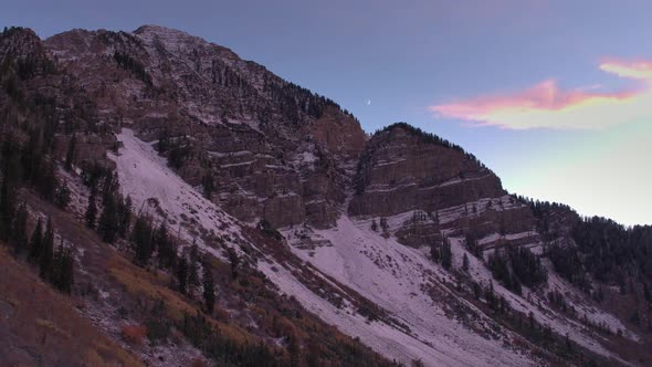 Aerial view of a colorful mountainside in the fall at sunset. alt