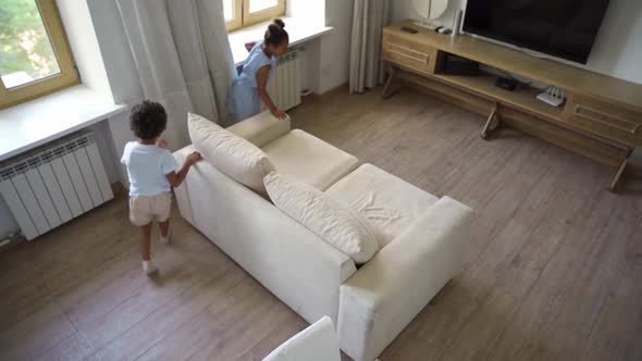 Little African American Brother and Sister Have Fun at Home Play in Living Room