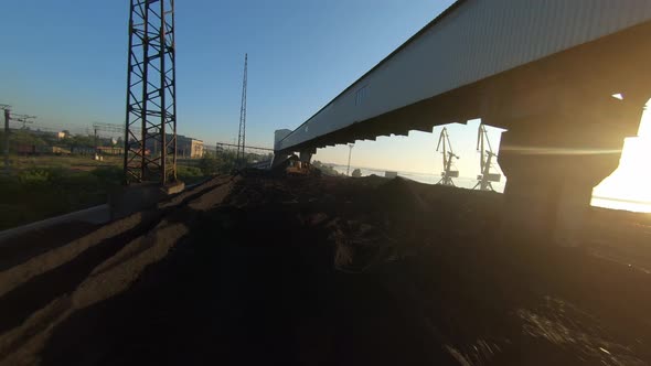 FPV Drone View Flight Over Coal Delivery Terminal with Port Cranes for Thermal Power Plant at