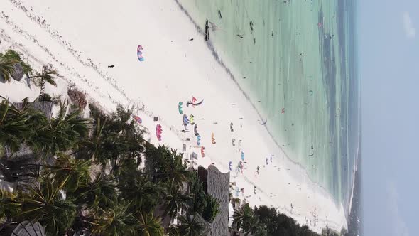 Zanzibar Tanzania  Vertical Video Kitesurfing Near the Shore of Ocean Slow Motion alt