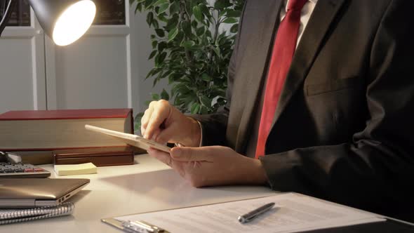 Businessman Using Tablet at Working Place