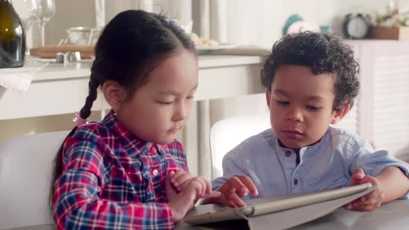 Mixed-Raced Kids Using Tablet Together