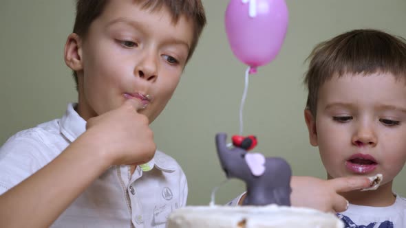 A red banded birthday cake. Pastry shop advertisment. Children eating birthday cake.