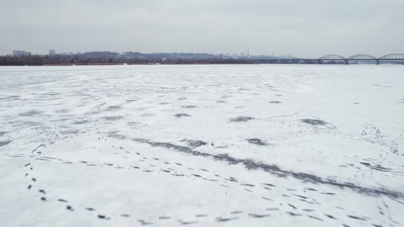 Flight Over the Frozen River Dnieper in the Direction of the City of Kyiv
