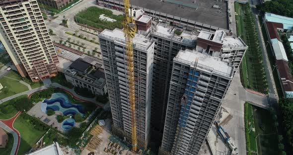 Aerial footage of multistory apartment construction site in China alt