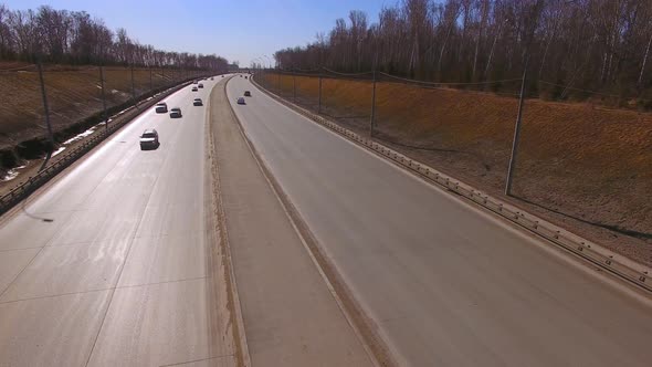 A Drone Flies Over the Highway, Cars Go Below