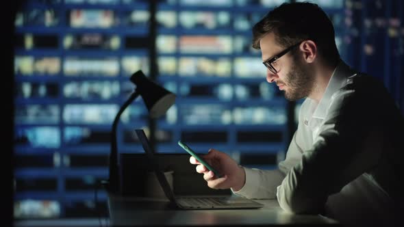 Man Sms Texting Using App on Smart Phone at Night alt