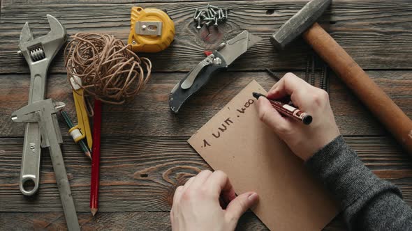 Experienced Carpenter in Work Clothes and Small Buiness Owner Is Carving a Wooden Board Design alt