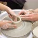 Child Hands Form Pot Out of White Clay Rotating It on Potters Wheel in Workshop - VideoHive Item for Sale