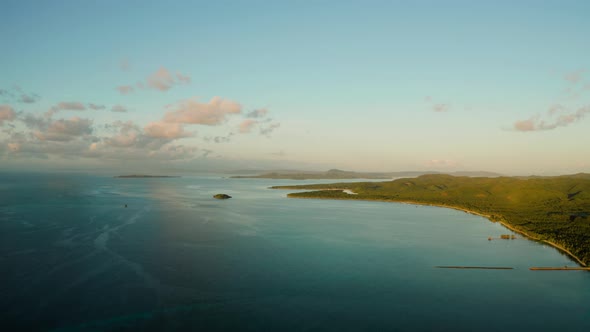 Blue Sea and Clouds at Sunrise in the Philippines alt