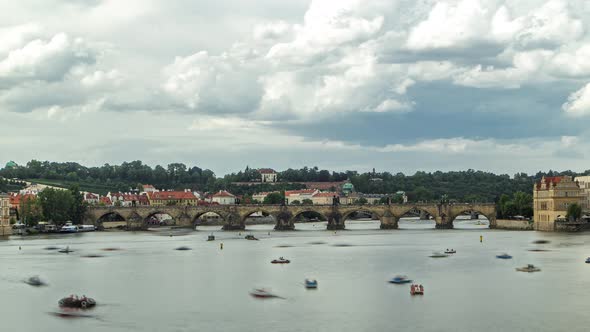 View of the City Prague in Czech Republic with Colorful Paddle Boats Timelapse on the Vltava River alt