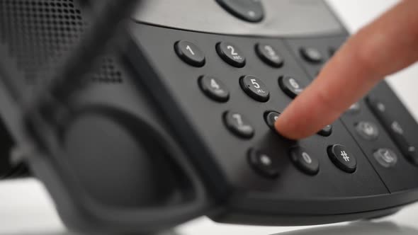 Male Hand Dialing Telephone Number