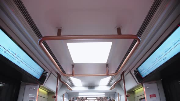 View of Metro Car Ceiling with Illumination and Displays Showing the Titles of Moscow Metropolitan