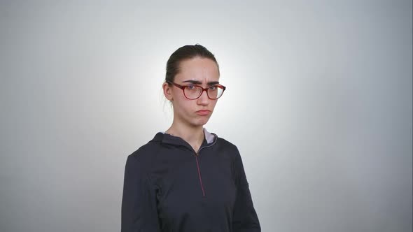 Closeup Portrait Angry, Arrogant, Sly, Scheming Young Woman in Glasses Plotting Something Isolated alt