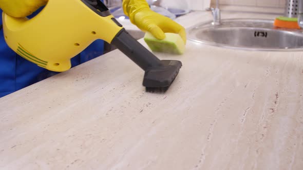 House Cleaning Concept. Man Worker Cleaning Kitchen alt