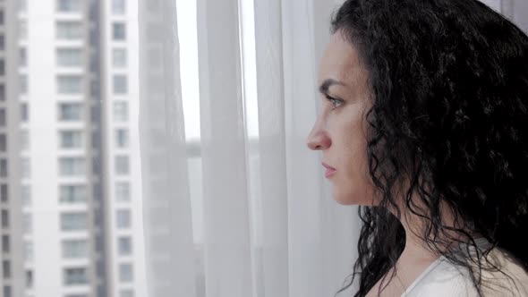 Portrait Caucasian Woman Standing By the Near the Big Window Holding Mug Coffee. Attractive Lady or alt