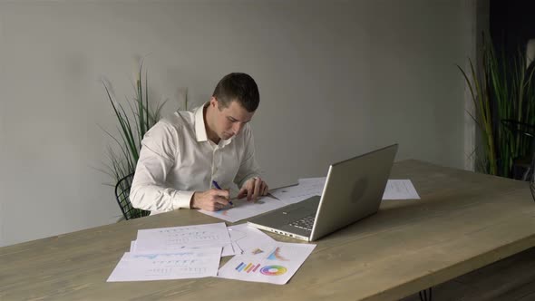 manager works with papers in the office alt