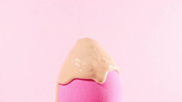 Makeup Liquid Beige Foundation Pouring on Sponge Closeup alt