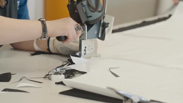 Worker Using a Circular Textile Knife alt
