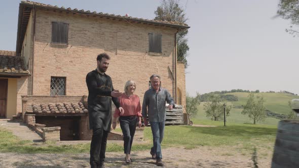 Senior couple on holiday visiting vineyard