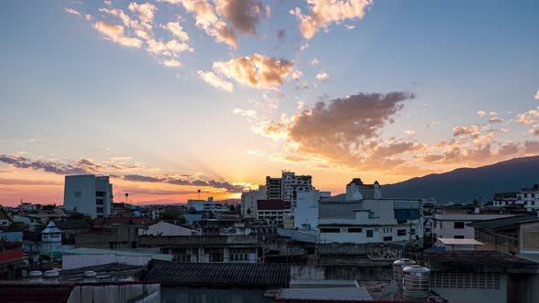 Establishing time lapse Shot of change of light sunset above Thailand city skyline