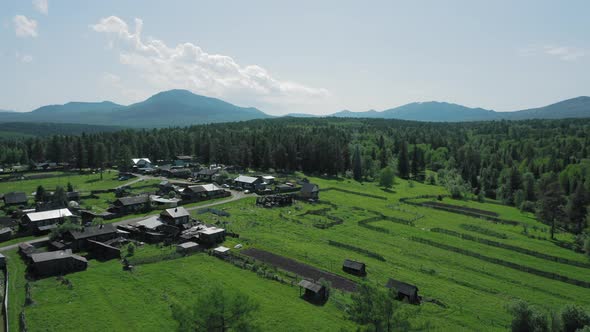 Aerial View of Mountain Range in Ural and Little Households