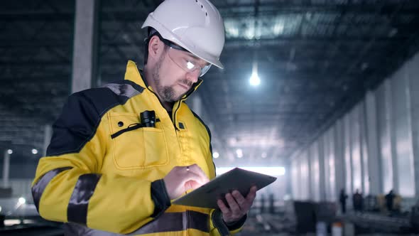 Portrait of Professional Heavy Industry Engineer / Worker Wearing Safety Uniform,  alt