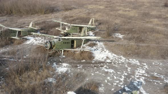 Three Broken Transport Planes An2  Colt  Transport Aircrafts Biplanes on the Airfield alt