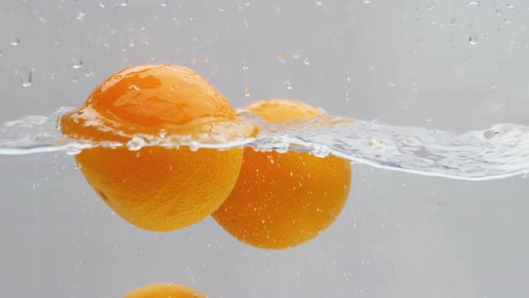 Orange Dropping In Water