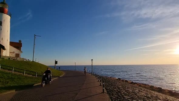 Winter in Urk with the Dike and Beach By the Lighthouse of Urk Snow Covered During Winter Sunset By alt