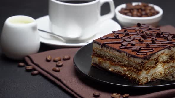 Portion of Traditional Italian Tiramisu dessert, cream or milk and cup of espresso coffee alt