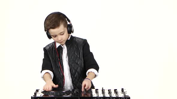 Cool Boy Dj in Headphones Playing on Vinyl. White Background alt