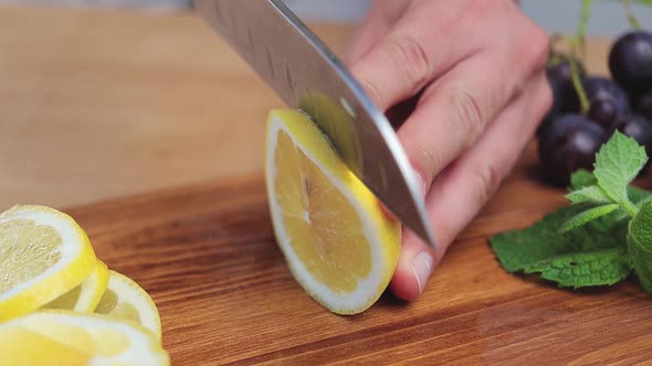 Lemon fruit cutting on the board for the lemonade or cocktail, extreme close up view