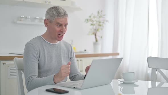 Senior Old Man Doing Video Chat on Laptop at Home alt